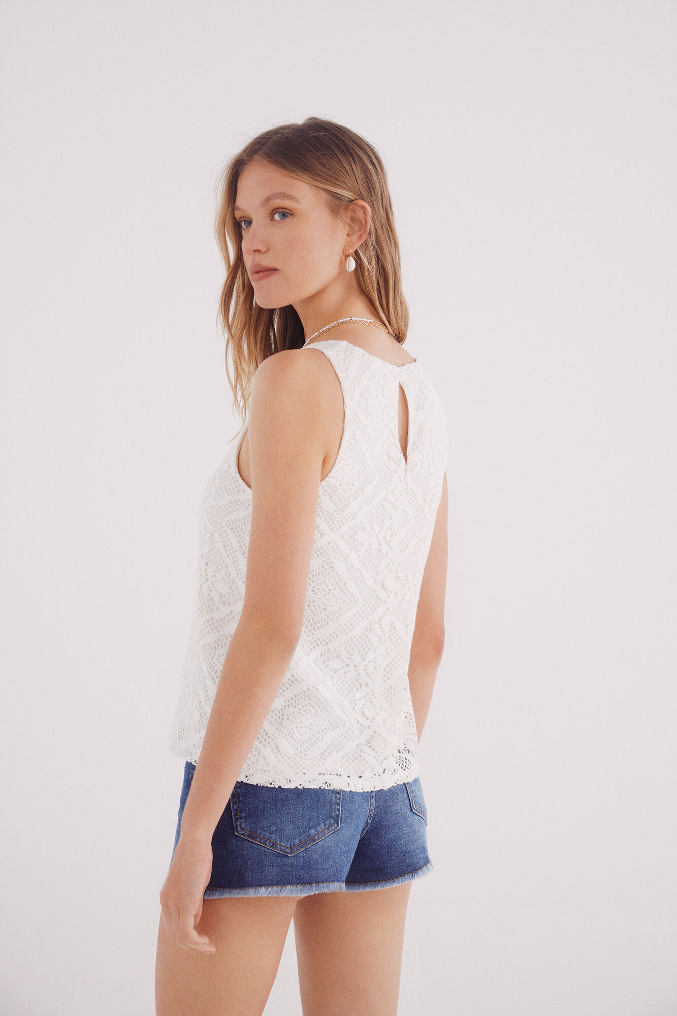 Springfield Top estructura rombos flores beige