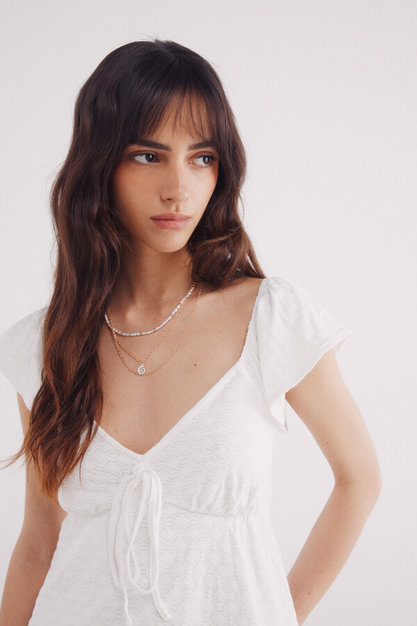 Springfield Top escote lazo bordado suizo natural